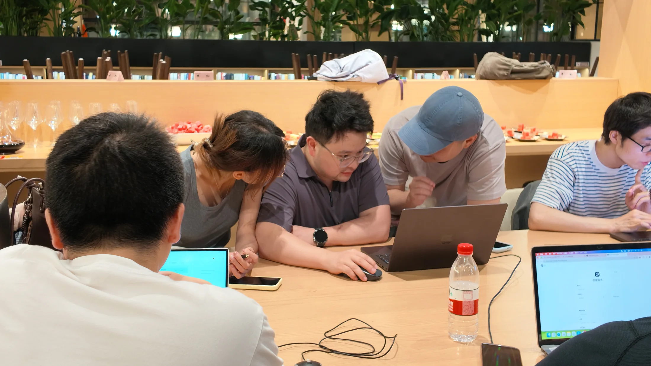Participants comparing work and helping one another at the SankiWork Shanghai workshop.